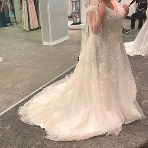 Wedding dress for sale. Comes with matching veil. No alterations were made.